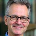 Professional headshot of Prof. Alan Hughes.